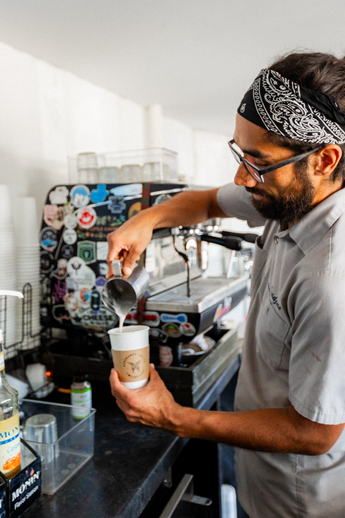 A barista preparing coffee at the cafe espresso machine