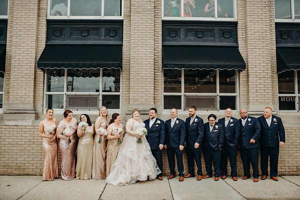 A bridal party outside the historic bank entrance on Washington Avenue
