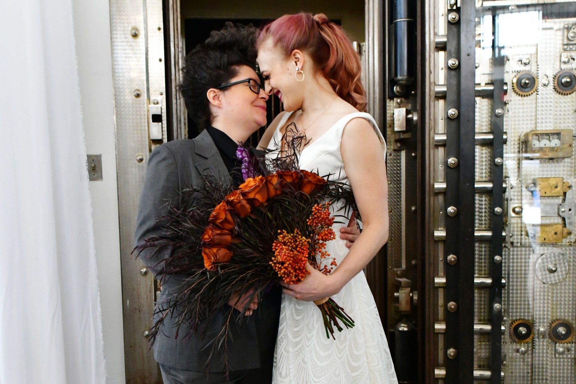 A couple at the open historic vault door
